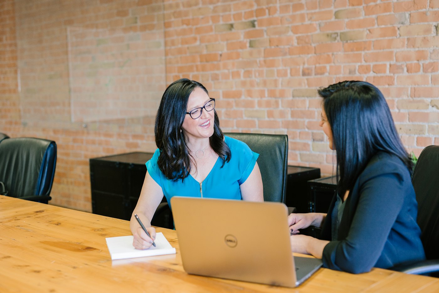 A business owner discussing her requirements with an advisor